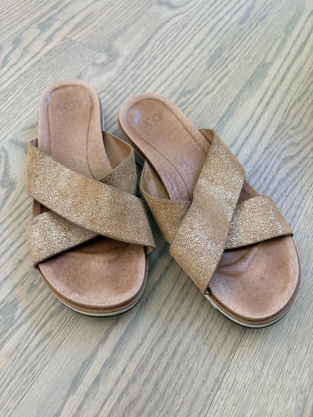 Gold UGG criss-cross sandals